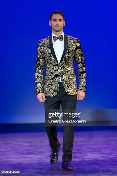 Model walks the runway wearing a Giovanni Testi design at the Metropolitan Fashion Week Closing Night Gala at Arcadia Performing Arts Center on...