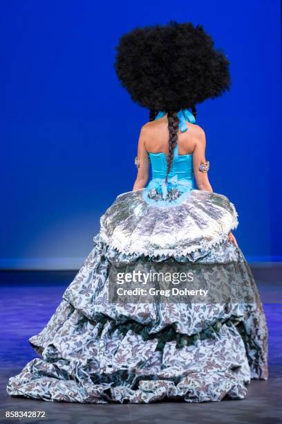 Model walks the runway wearing a Ricardo Saltero design at the Metropolitan Fashion Week Closing Night Gala at Arcadia Performing Arts Center on...