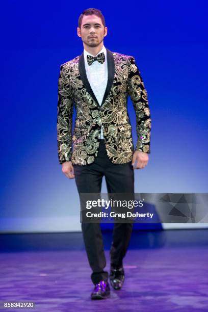 Model walks the runway wearing a Giovanni Testi design at the Metropolitan Fashion Week Closing Night Gala at Arcadia Performing Arts Center on...