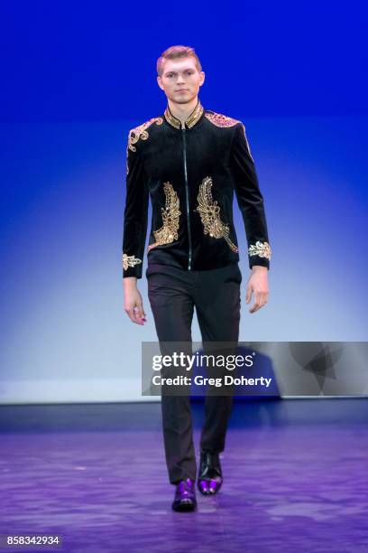 Model walks the runway wearing a Giovanni Testi design at the Metropolitan Fashion Week Closing Night Gala at Arcadia Performing Arts Center on...