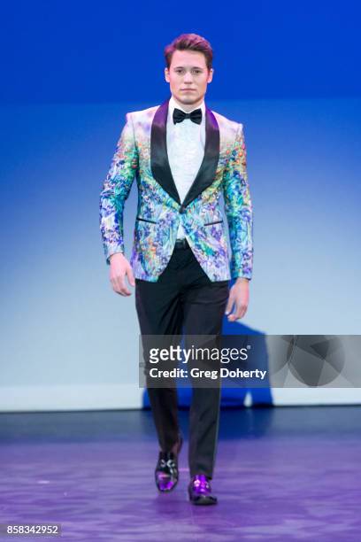Model walks the runway wearing a Giovanni Testi design at the Metropolitan Fashion Week Closing Night Gala at Arcadia Performing Arts Center on...