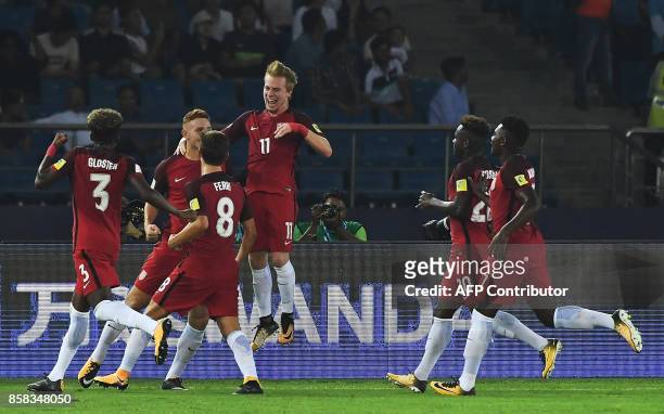 United State football players celebrate a goal against India during the FIFA U-17 World Cup 2017 football match between India and USA at Jawahar Lal...
