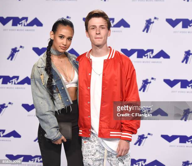 Actress Emily Tosta and actor Crawford Collins attend the 2017 MTV Video Music Awards at The Forum on August 27, 2017 in Inglewood, California.