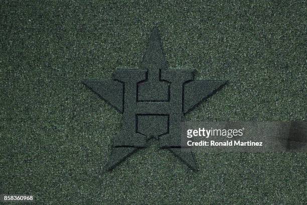 The Houston Astros logo is seen on the centerfield wall before game two of the American League Division Series between the Boston Red Sox and the...