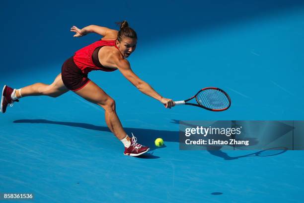 Simona Halep of Romania returns a shot during the Women's singles Quarterfinals match against Daria Kasatkina of Russia on day seven of 2017 China...