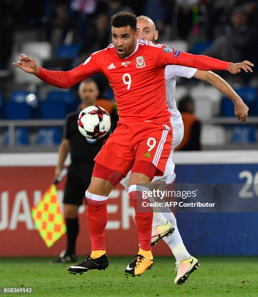 Wales' striker Hal Robson-Kanu and Georgia's midfielder Valeri Gvilia vie for the ball during the FIFA World Cup 2018 qualification football match...