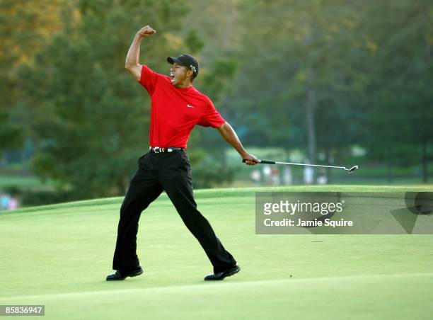 Tiger Woods celebrates after sinking a putt on the first playoff hole to win the 2005 Masters on April 10, 2005 at Augusta National Golf Course in...