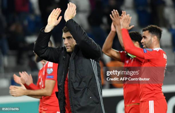 Wales' players celebrate after the FIFA World Cup 2018 qualification football match between Georgia and Wales in Tbilisi on October 6, 2017. / AFP...