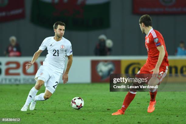 Otar Kakabadze of Georgia and Ben Davies of Wales in action during the FIFA 2018 World Cup Qualifier between Georgia and Wales at Boris Paichadze...