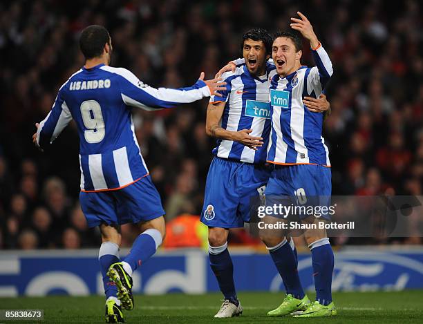 Cristian Rodriguez of FC Porto celebrates with his team mates after scoring the opening goal during the UEFA Champions League Quarter Final First Leg...