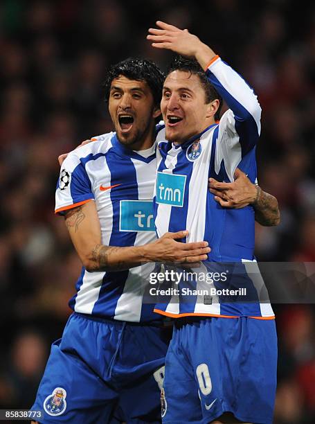 Cristian Rodriguez of FC Porto celebrates with team mate Lucho after scoring the opening goal during the UEFA Champions League Quarter Final First...