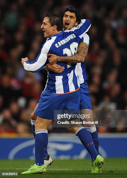 Cristian Rodriguez of FC Porto celebrates with team mate Lucho after scoring the opening goal during the UEFA Champions League Quarter Final First...