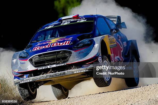 The french driver, Sbastien Ogier and his co-driver Julien Ingrassia of M-Sport team jumping with his Ford Fiesta WRC during the first day of Rally...