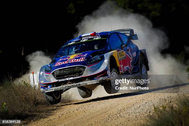 The french driver, Sbastien Ogier and his co-driver Julien Ingrassia of M-Sport team jumping with his Ford Fiesta WRC during the first day of Rally...