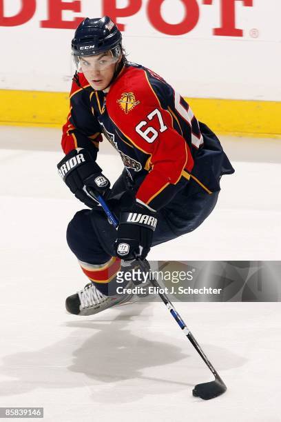 Michael Frolik of the Florida Panthers skates with the puck against the Pittsburgh Penguins at the Bank Atlantic Center on April 5, 2009 in Sunrise,...