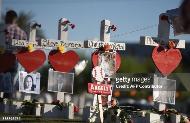 Some of the 58 white crosses for the victims of Sunday night's mass shooting, on Las Vegas Strip just south of the Mandalay Bay hotel, October 6,...