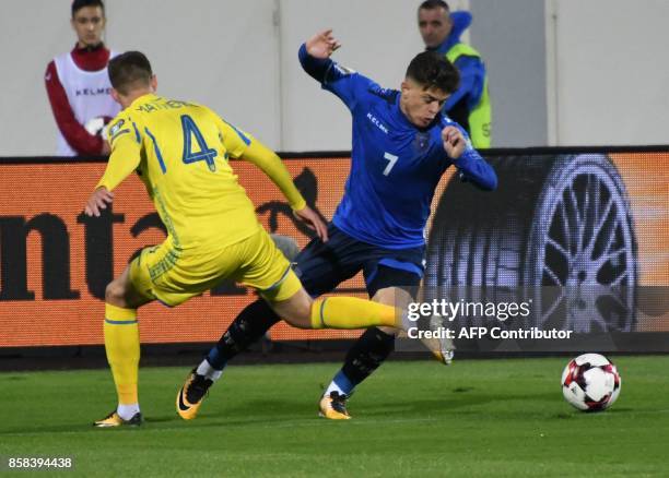 Ukraine's defender Mykola Matviyenko fights for the ball with Kosovo's midfielder Milot Rashica during the FIFA World Cup 2018 qualification football...