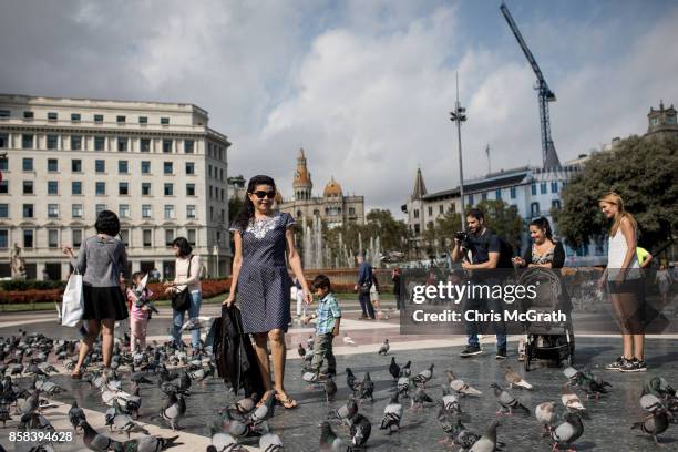 Tourists Pose for photos in Catalunya Square on October 6, 2017 in Barcelona, Spain. Tension between the central government and the Catalan region...