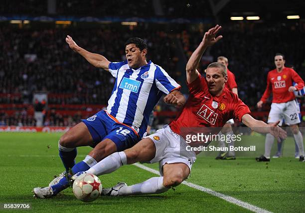 Nemanja Vidic of Manchester United tackles Hulk of FC Porto during the UEFA Champions League Quarter Final First Leg match between Manchester United...
