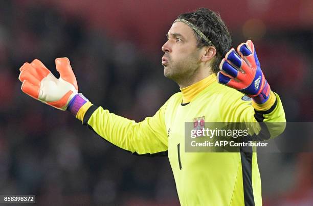 Serbia's goalkeeper Vladimir Stojkovic celebrates after his team scored during the FIFA World Cup 2018 qualification football match between Austria...