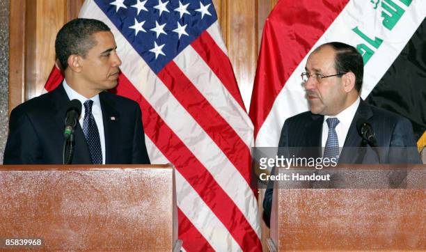 In this handout image provided by the Iraqi Prime Minister's office, Iraqi Prime Minister Nuri al-Maliki and U.S. President Barack Obama speak during...
