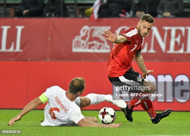 Serbia's Branislav Ivanovic vies with Austria's Marko Arnautovic during he FIFA World Cup 2018 qualification football match between Austria and...