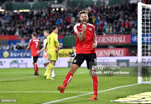 Austria's Guido Burgstaller celebrates after scoring a goal during he FIFA World Cup 2018 qualification football match between Austria and Serbia at...