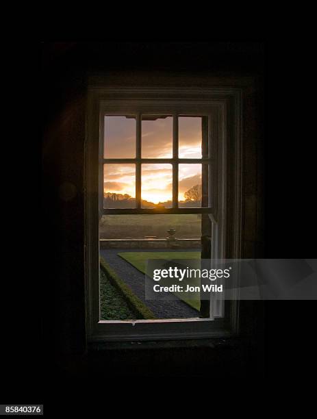 sunset through open sash window - sash windows stock pictures, royalty-free photos & images