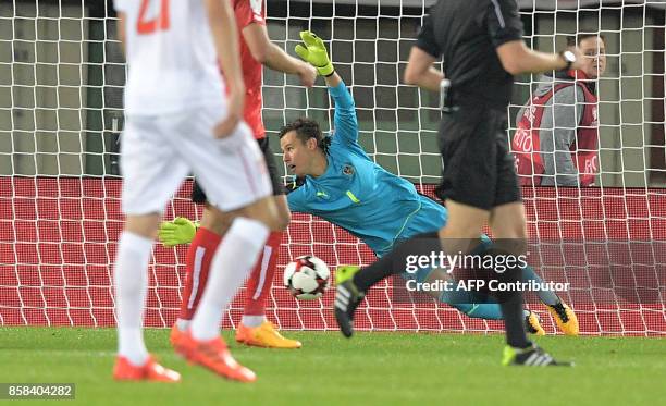 Austria's goalkeeper Heinz Lindner fails to stop a ball during the FIFA World Cup 2018 qualification football match between Austria and Serbia at the...