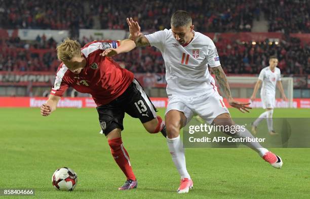 Austria's Moritz Bauer vies with Serbia's Aleksandar Kolarov during the FIFA World Cup 2018 qualification football match between Austria and Serbia...