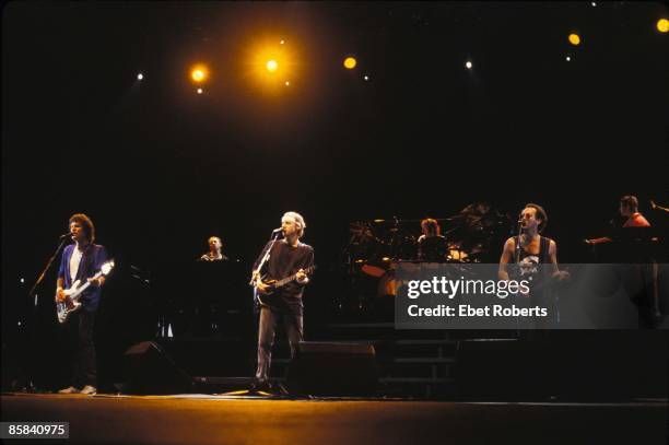 Photo of Jack SONNI and Terry WILLIAMS and Mark KNOPFLER and Alan CLARK and John ILLSLEY and DIRE STRAITS and Guy FLETCHER; L-R: John Illsley, Alan...