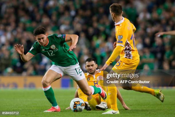 Moldovia's midfielder Alexandru Gatcan challenges Republic of Ireland's midfielder Callum O'Dowda during the FIFA World Cup 2018 qualification...