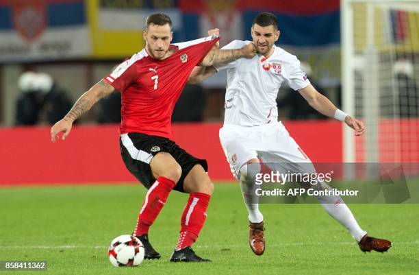 Austria's Marko Arnautovic vies with Serbia's Stefan Mitrovic during the FIFA World Cup 2018 qualification football match between Austria and Serbia...