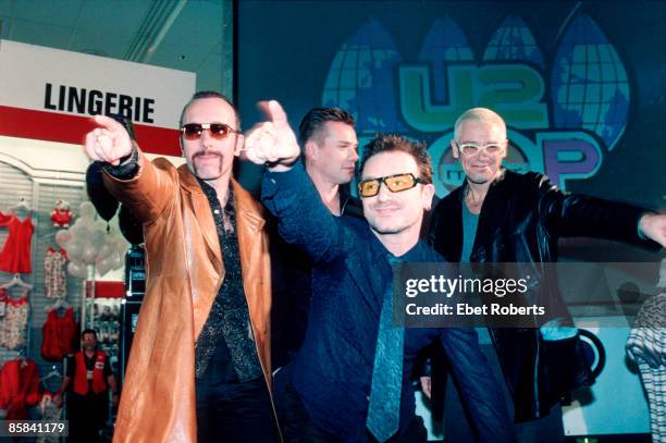 Photo of U2; L-R: The Edge, Larry Mullen Jnr, Bono, Adam Clayton - posed, group shot - at promotional show in Greenwich Village K-Mart shop lingerie...