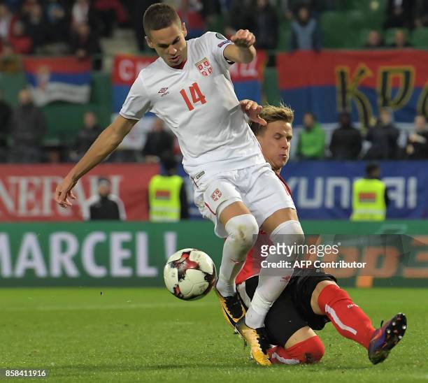 Austria's Moritz Bauer vies with Serbia's Mijat Gacinovic during the FIFA World Cup 2018 qualification football match between Austria and Serbia at...