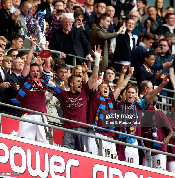 West Ham captain Kevin Nolan lifts the trophy as the team celebrate after winning the nPower Championship Playoff Final between West Ham United and...