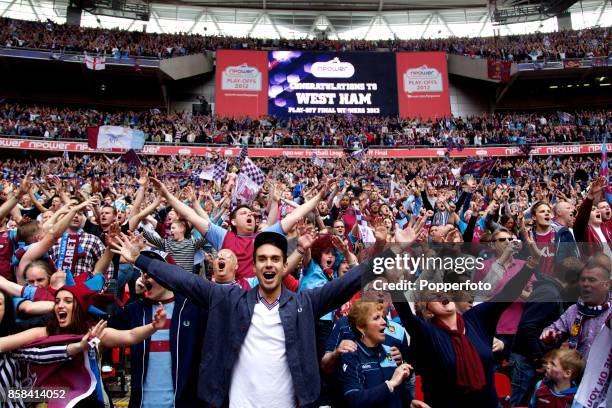 West Ham fans celebrate with after winning the nPower Championship Playoff Final between West Ham United and Blackpool at Wembley Stadium on May 19,...