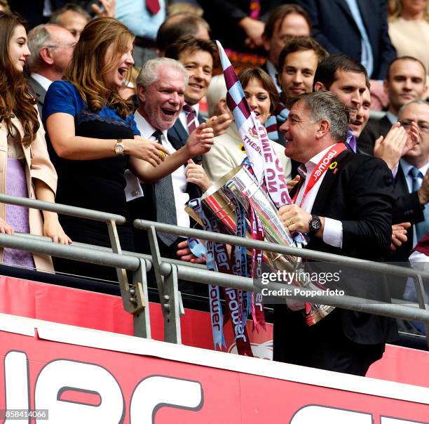 West Ham manager Sam Allardyce celebrates with Vice-Chairman of the club Karren Brady and Joint Chairman David Gold after winning the nPower...