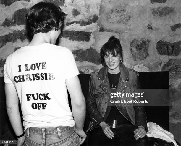 Photo of PRETENDERS and Chrissie HYNDE, Chrissie Hynde backstage at Toads Place, smoking cigarette, drink, beer