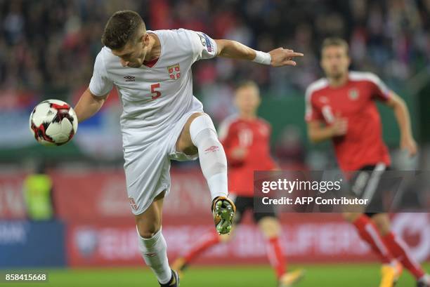 Serbia's Matija Nastasic heads a ball during the FIFA World Cup 2018 qualification football match between Austria and Serbia at the Ernst Happel...