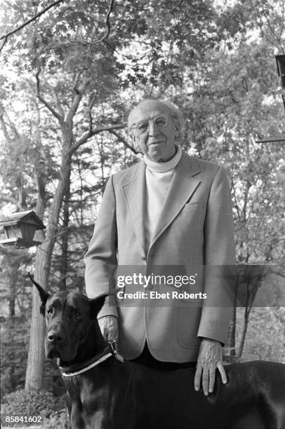 Aaron COPLAND; Posed portrait of Aaron Copland at his home at Rockhill in Cortlandt Manor, pet dog