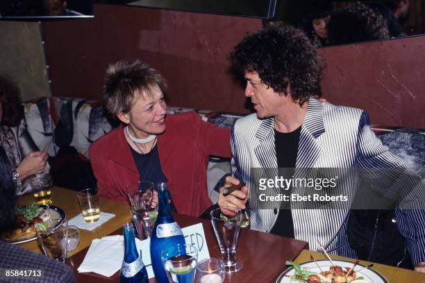 Lou REED and Laurie ANDERSON, Laurie Anderson and Lou Reed, food, drink, smoking cigar