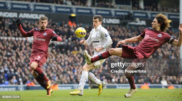 Fabricio Coloccini of Newcastle hooks the ball away from Gareth Bale of Tottenham during the Barclay's Premier League match between Tottenham Hotspur...