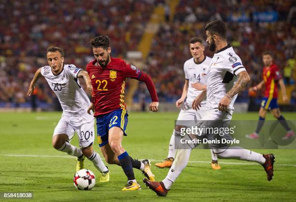 Isco Alarcon of Spain runs past Ergys Kace of Albania during the FIFA 2018 World Cup Qualifier between Spain and Albania at Estadio Jose Rico Perez...