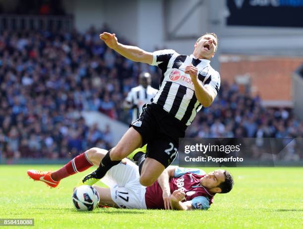 Steven Taylor of Newcastle is fouled by Joey O'Brien of West Ham during the Barclays Premier League match between West Ham United and Newcastle...