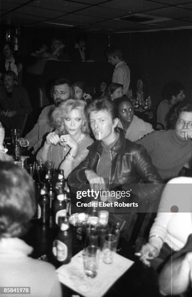 Photo of David BOWIE, standing at bar