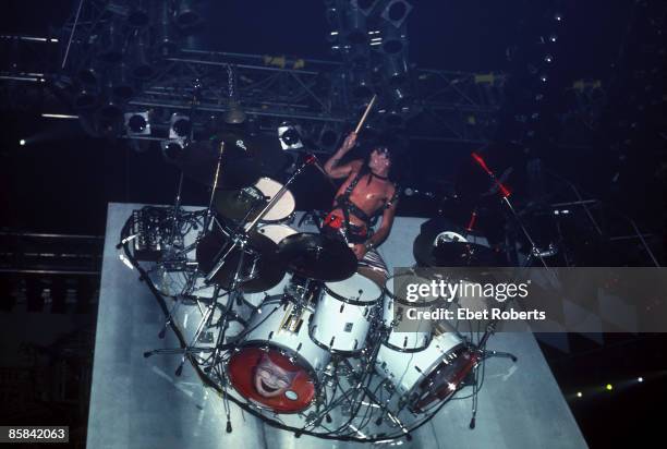 Photo of Tommy LEE and MOTLEY CRUE, Tommy Lee performing live onstage, playing revolving drum kit