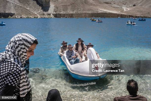 Afghan men on a swan-shaped pedalo at Band-e Haibat lake at Band-e Amir, Afghanistan's first national park on August 11, 2017 in Band-e Amir,...