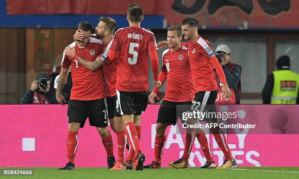 Austrian players celebrate after scoring a second goal during the FIFA World Cup 2018 qualification football match between Austria and Serbia at the...