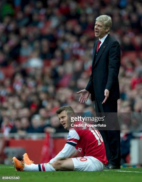 Arsene Wenger, Arsenal manager , with Jack Wilshere of Arsenal during the match between Arsenal and Sunderland in the Barclays Premier League at the...